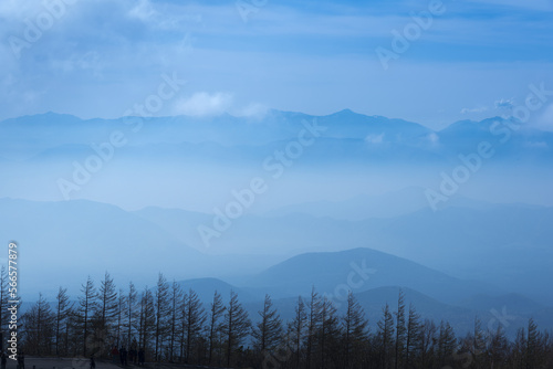 Fototapeta Naklejka Na Ścianę i Meble -  Japan mountain range in hazy blue sunshine.