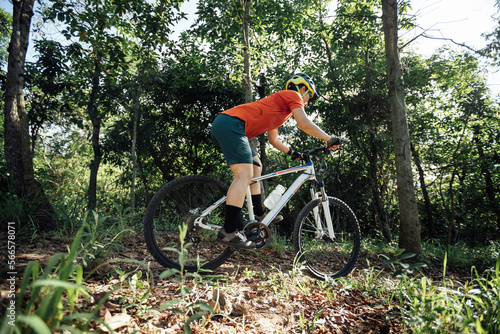 Fototapeta Naklejka Na Ścianę i Meble -  Mountain biking in summer forest
