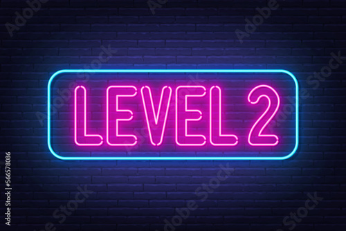 Level 2 neon sign on brick wall background.