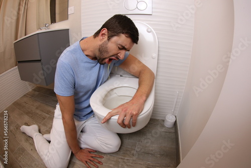 Man vomiting because of indigestion   photo