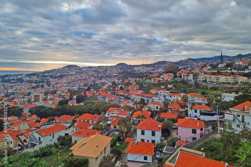 Bright rooftops of houses on the island of MAdeira in the Atlantic Ocean.