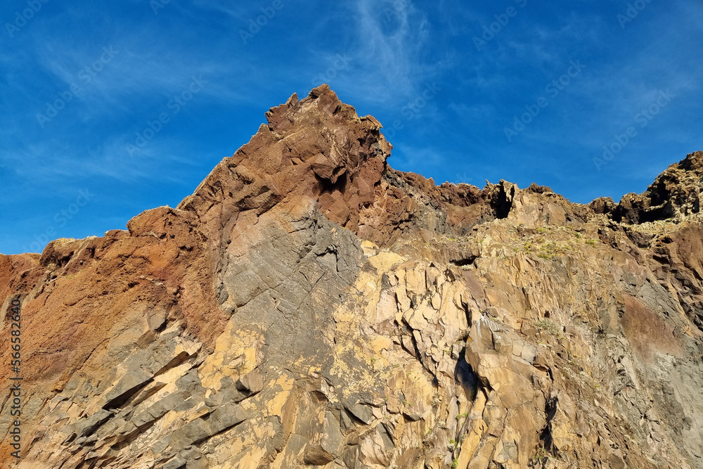 Beautiful red and yellow rocks on the island of MAdeira. Volcanic rocks.