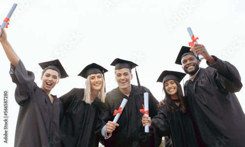 Graduation  friends and portrait of students with success  education award and achievement in college. School  graduate and group of people in celebration for certificate  diploma and academic degree
