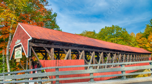 Bartlett, NH - October 13, 2015: Wooden Bridge on a sunny autumn day photo