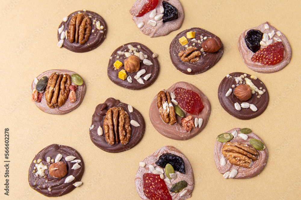 French sweets Mendiants. Chocolate candies with berries and nuts French sweets Mendiants. Chocolate candies with berries and nuts