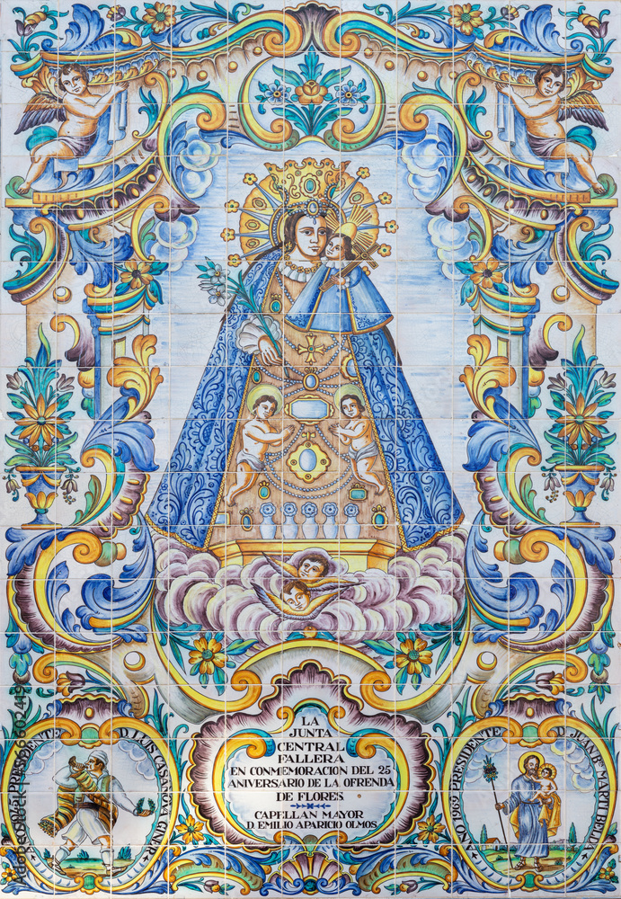 VALENCIA, SPAIN - FEBRUAR 17, 2022: The ceramic tiled Madonna on the facade of church Basilica de la Mare de Deu dels Desamparats by J. Gimeno from 20. cent.