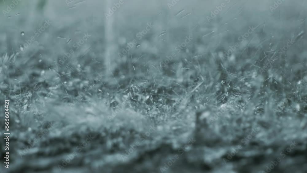 Splashes of rainwater that fall to the ground do not absorb completely and create puddles Splashes of rainwater that fall to the ground do not absorb completely and create puddles