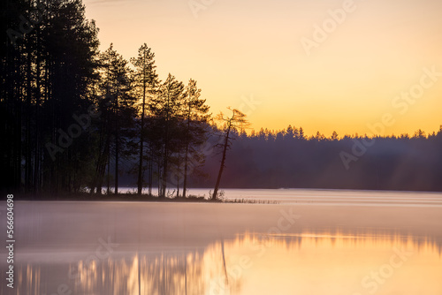 sunset over the lake, calm and bright sky karelia