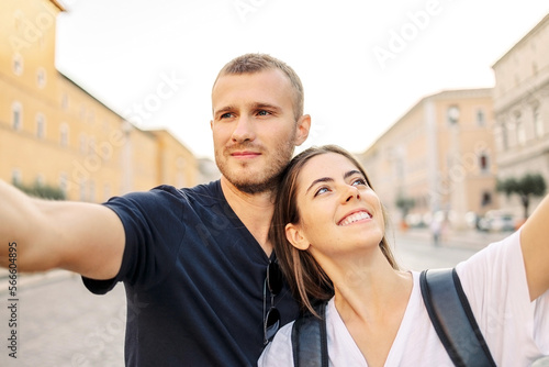 Happy Young couple taking selfie portrait with smartphone mobile outdoor. Tourism, friendship, youth and weekend activities concept. Close up portrait. Tourism, selfie photos, bloggers © Olga