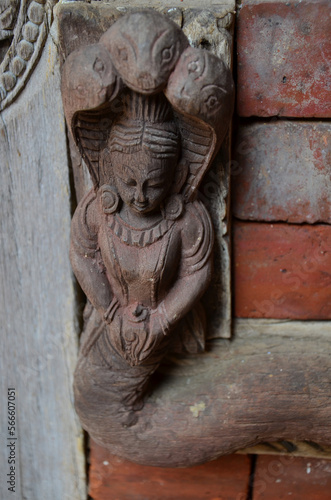 Ancient wood architecture and antique art wooden carved nepalese angel deity god in old ruins building for nepali people foreign travelers travel visit at Basantapur Katmandu city in Kathmandu  Nepal