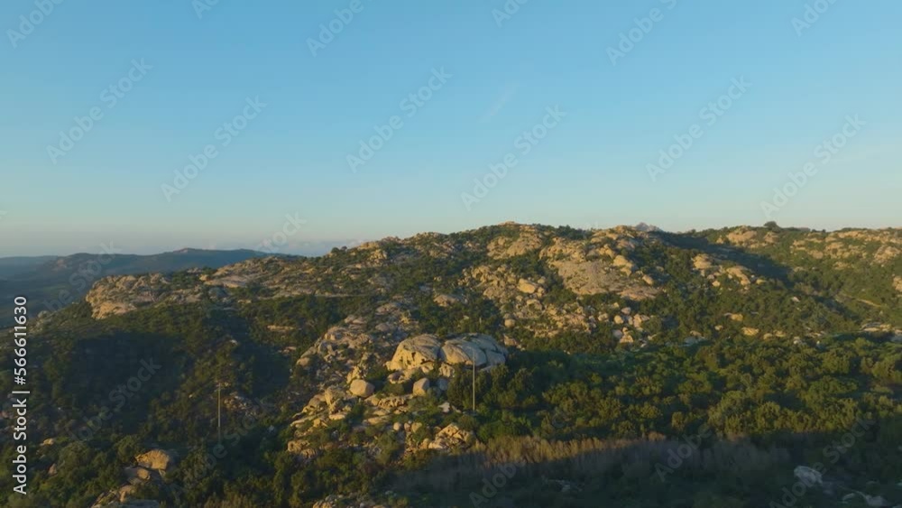 Green countryside with rocky mountains at sunset Green countryside with rocky mountains at sunset