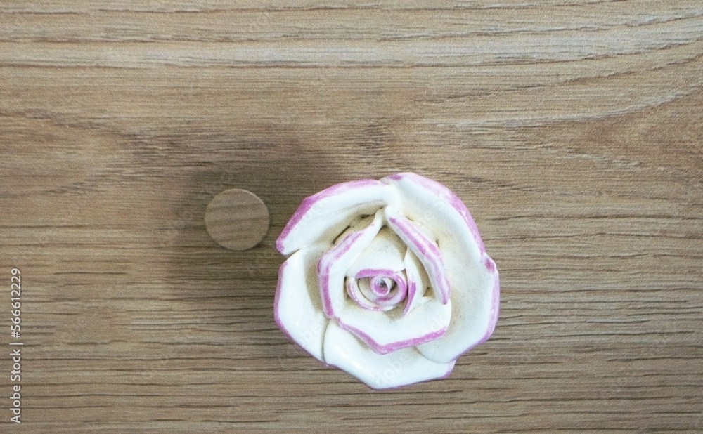 Α small white rose, in a wooden desk drawer, decoration