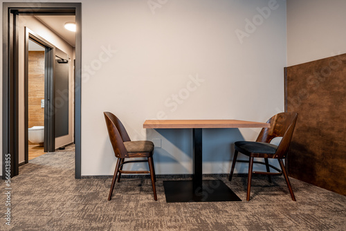 table and chairs in the hotel room