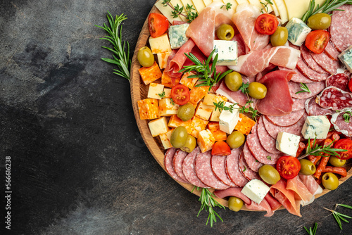 appetizers or antipasto set with gourmet food. Mixed delicatessen of cheese and meat snacks, Food recipe background. Close up