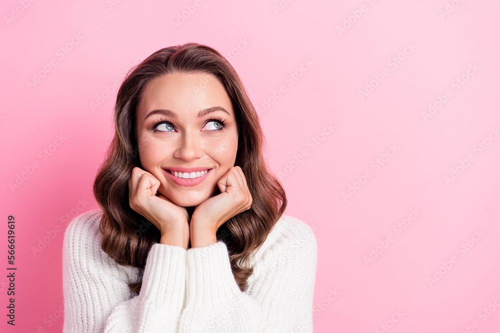 Portrait of gorgeous positive sweet lady beaming smile arms touch cheeks look empty space isolated on pink color background