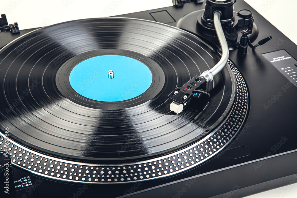 Playing a vinyl record on a turntable Playing a vinyl record on a turntable