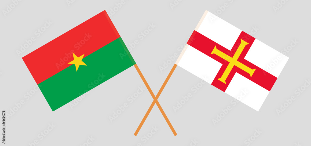 Crossed flags of Burkina Faso and Bailiwick of Guernsey. Official colors. Correct proportion