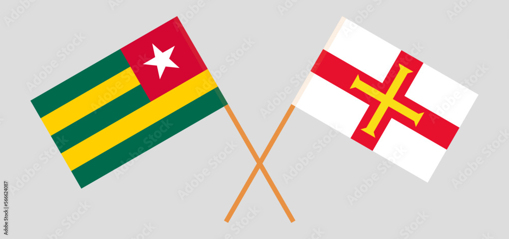 Crossed flags of Togo and Bailiwick of Guernsey. Official colors. Correct proportion