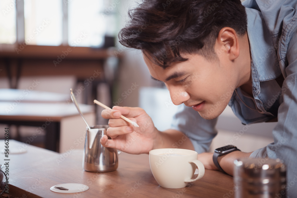 Before competing in the championship level coffee brewing competition, Young baristas practice their coffee latte makeup techniques to become proficient. Before competing in the championship level coffee brewing competition, Young baristas practice their coffee latte makeup techniques to become proficient.