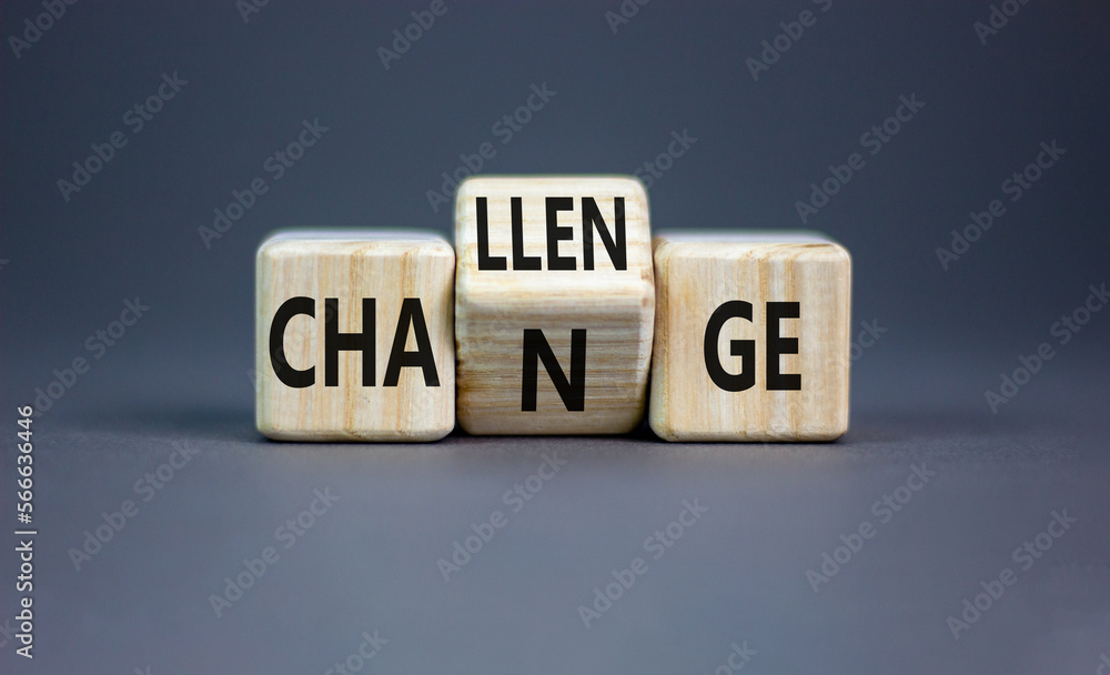 Challenge and change symbol. Concept word Challenge Change on wooden cubes. Beautiful grey table grey background. Business and challenge and change concept. Copy space. Challenge and change symbol. Concept word Challenge Change on wooden cubes. Beautiful grey table grey background. Business and challenge and change concept. Copy space.
