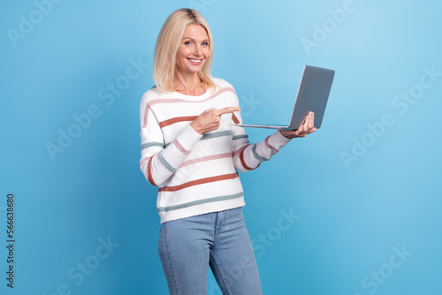 Photo of cute pretty woman dressed striped sweater pointing apple samsung modern gadget isolated blue color background