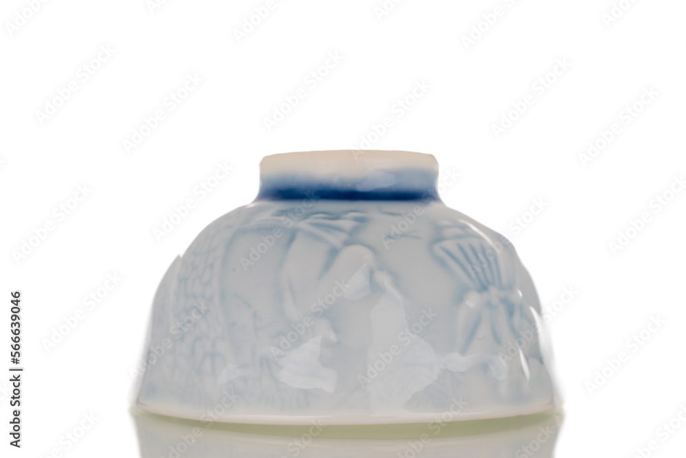 One ceramic sake cup, macro, isolated on white background.