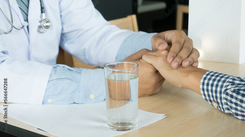 Doctor healthcare. Professional medical doctor in white uniform gown coat interview consulting patient reassuring his male patient helping hand Doctor healthcare. Professional medical doctor in white uniform gown coat interview consulting patient reassuring his male patient helping hand