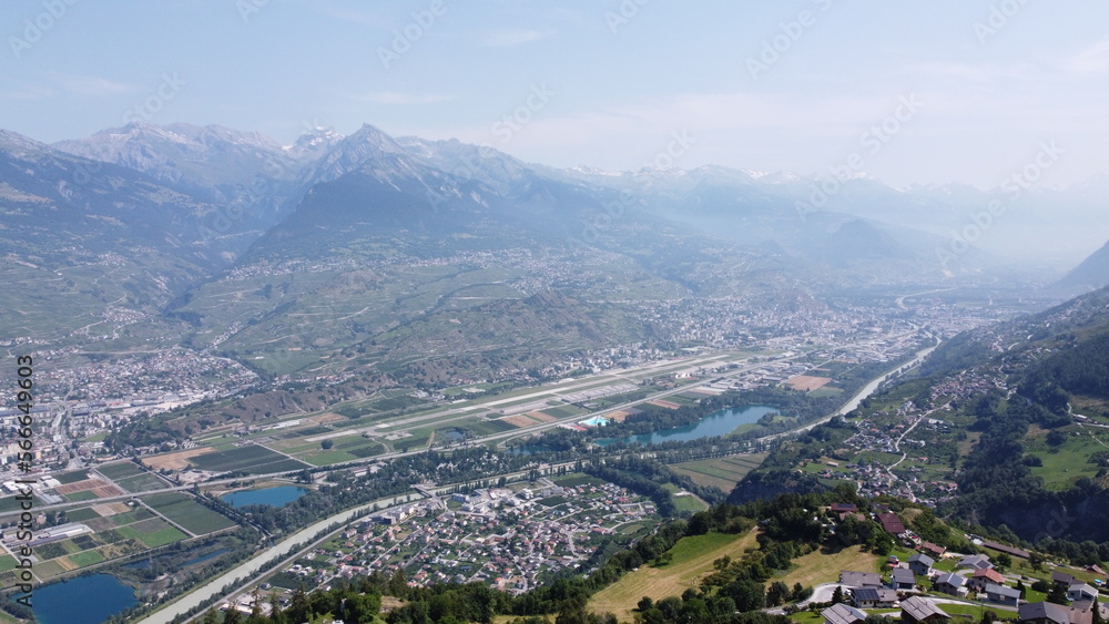 Swiss Alps in Sion region, aerial footage taken by a drone during warm summer time, clear blue skies and beautiful mountain scenery