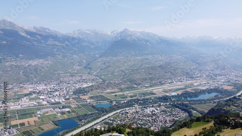 Swiss Alps in Sion region, aerial footage taken by a drone during warm summer time, clear blue skies and beautiful mountain scenery © Kosta