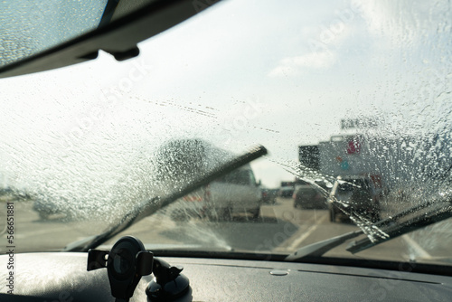 Wiper cleaning windshield