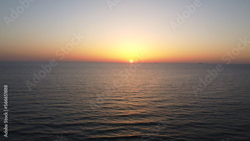 Summer sunset views of the Mediterranean sea. Clear blue sky with aerial capture
