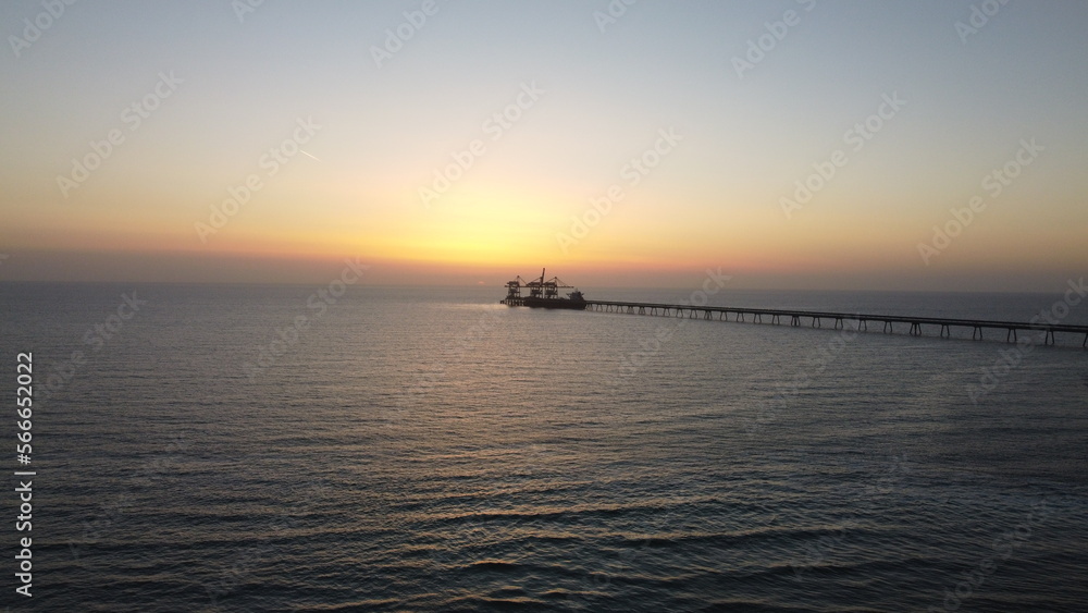 Summer sunset views of the Mediterranean sea. Clear blue sky with aerial capture Summer sunset views of the Mediterranean sea. Clear blue sky with aerial capture