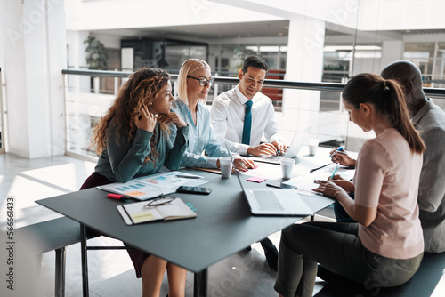 Diverse businesspeople smiling during an office meeting