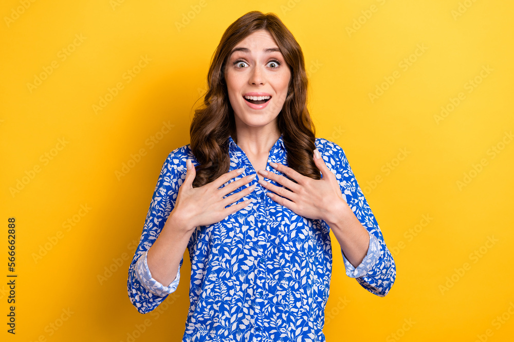 Photo of impressed funky lady wear print shirt smiling open mouth arms chest isolated yellow color background Photo of impressed funky lady wear print shirt smiling open mouth arms chest isolated yellow color background