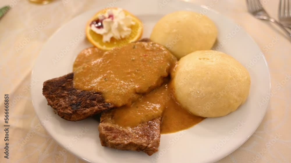Traditional Czech meal. Meat with Czech dumplings. Svíčková na smetaně, popular Czech meat dish. Traditional Czech meal. Meat with Czech dumplings. Svíčková na smetaně, popular Czech meat dish.