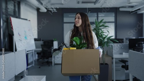 Getting a job. A young woman during the first working day. A new employee takes his desk