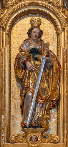 LUZERN, SWITZERLAND - JUNY 24, 2022: The carved polychrome statue of St. Catherine in the church St. Leodegar im Hof by Niklaus Geisler (1585-1665) photo