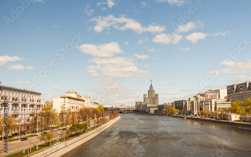 Sunny day in Moscow. May. Clouds, Moscow river and skyscraper building in background