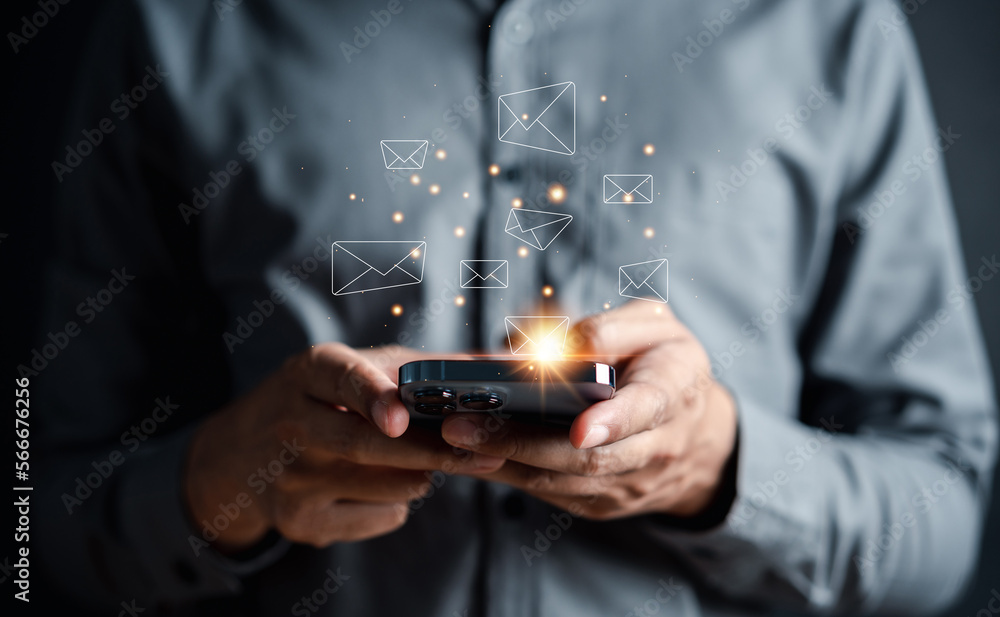 Businessman sending email by smartphone to customer, business contact and communication, email icon, email marketing concept, send e-mail or newsletter, online working internet network. Businessman sending email by smartphone to customer, business contact and communication, email icon, email marketing concept, send e-mail or newsletter, online working internet network.