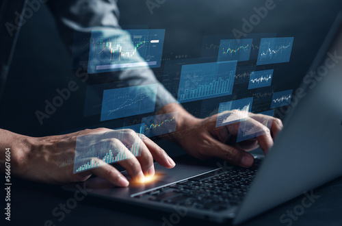 Business planning and strategy stock market, Business growth, progress or success. Businessman use laptop for trading with virtual hologram stock graph and chart, invest in trading.