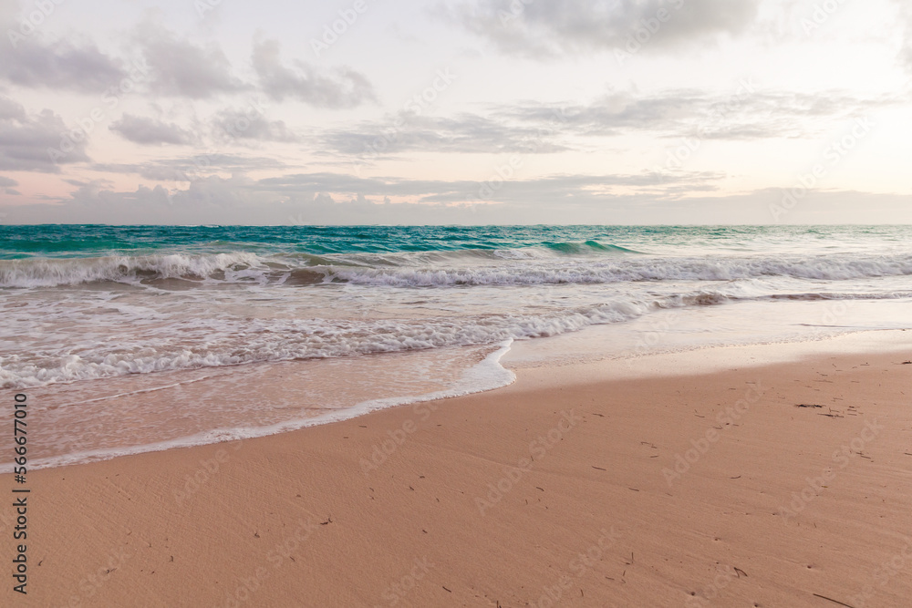 Empty sandy beach and shore waves in the morning