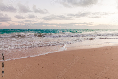Empty sandy beach and shore waves in the morning