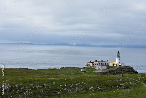 landscape of Neist Point Lighthouse isle of Skye , The white lighthouse on edge of cliff ,coastal lighthouse
