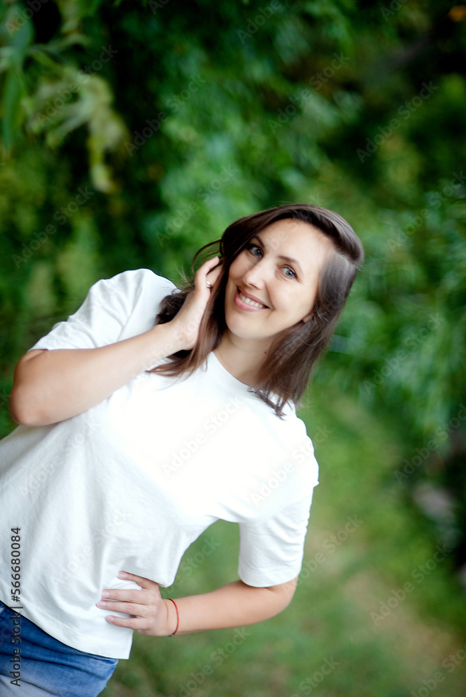 Young woman smiling outdoor. Beautiful brunete girl resting on park or garden green background. Free happy woman at summertime. Freedom happiness carefree happy people concept Young woman smiling outdoor. Beautiful brunete girl resting on park or garden green background. Free happy woman at summertime. Freedom happiness carefree happy people concept
