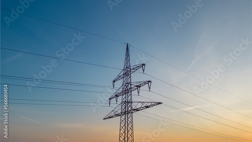 power pylon and power lines against the evening sky
