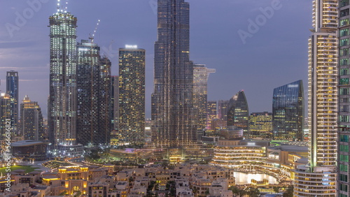 Dubai Downtown day to night transition with tallest skyscraper and other towers