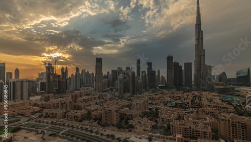 Sunset over Dubai Downtown with tallest skyscraper and other towers