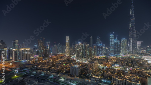 Panorama showing Dubai Downtown and business bay night with tallest skyscraper and other towers