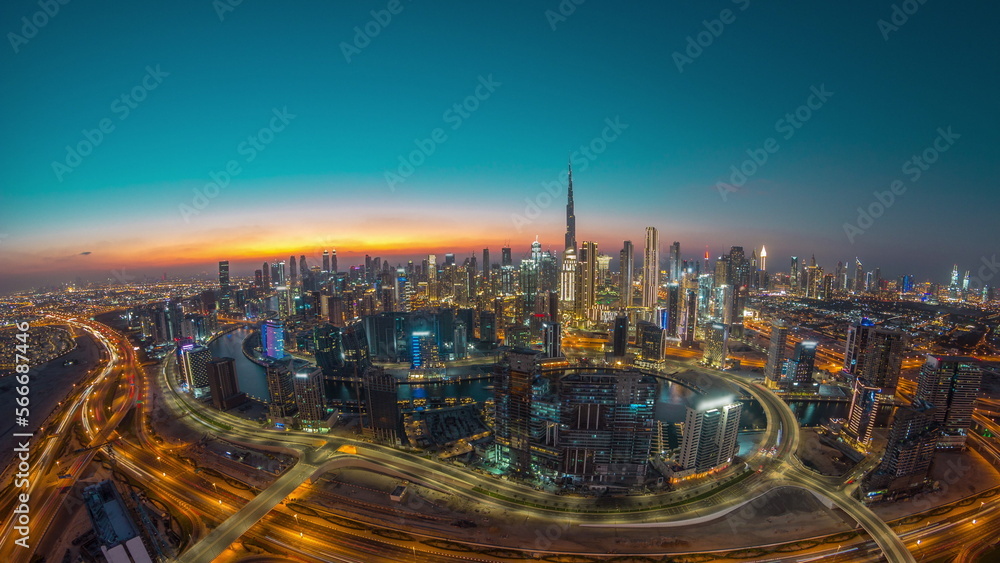 Fototapeta premium Panoramic skyline of Dubai with business bay and downtown district day to night .