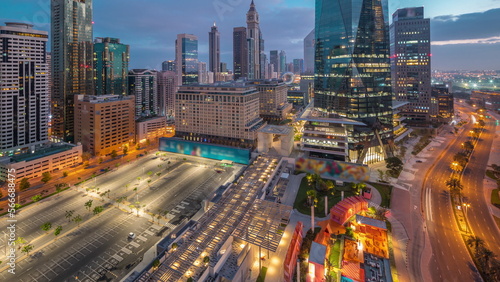 Dubai International Financial district aerial night to day . Panoramic view of business office towers.